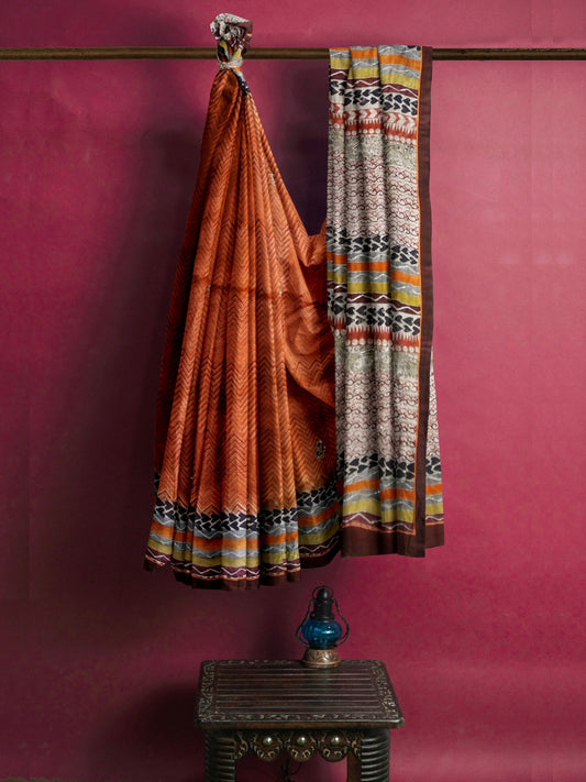 Nakshi Burnt Orange Geometric Hand Printed Tussar Silk Saree With Zari Embroidery & Dabka Work