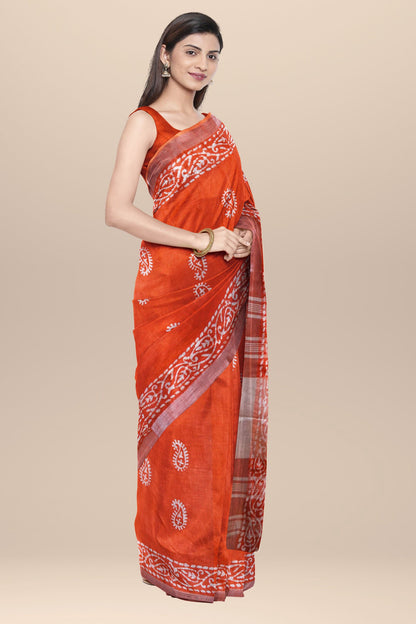 Nakshi Orange Cotton Batik Printed Saree